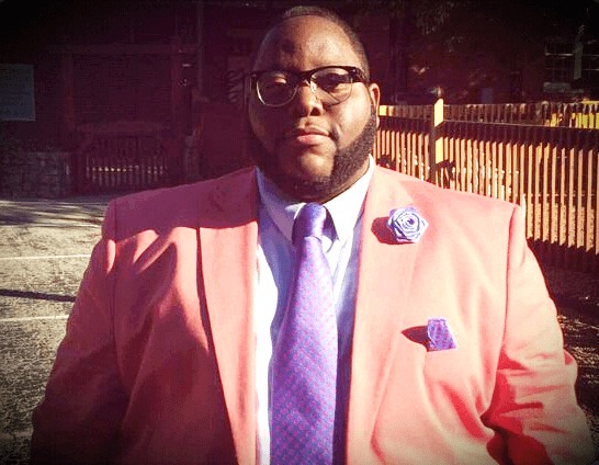 Marcus in the pink blazer