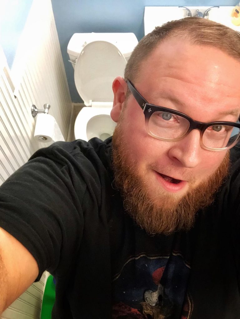 Selfie in front of toilet