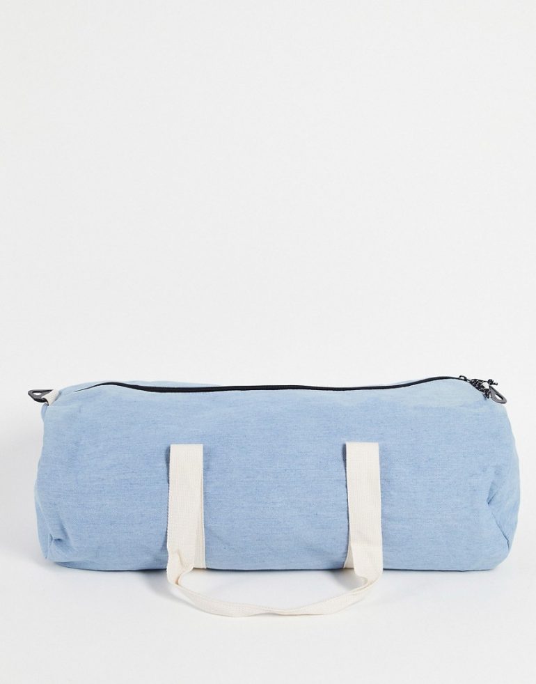 ASOS DESIGN gym barrel bag in stone wash denim with shoulder strap 37 liters-Blue